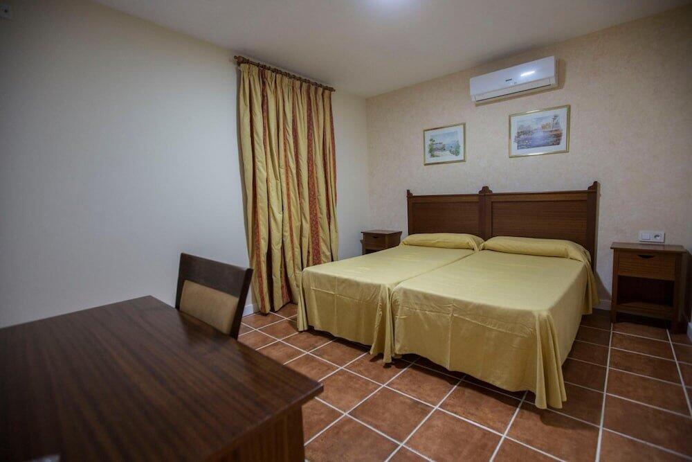 Foto de una habitación de Hotel Carlos V by Viverestays