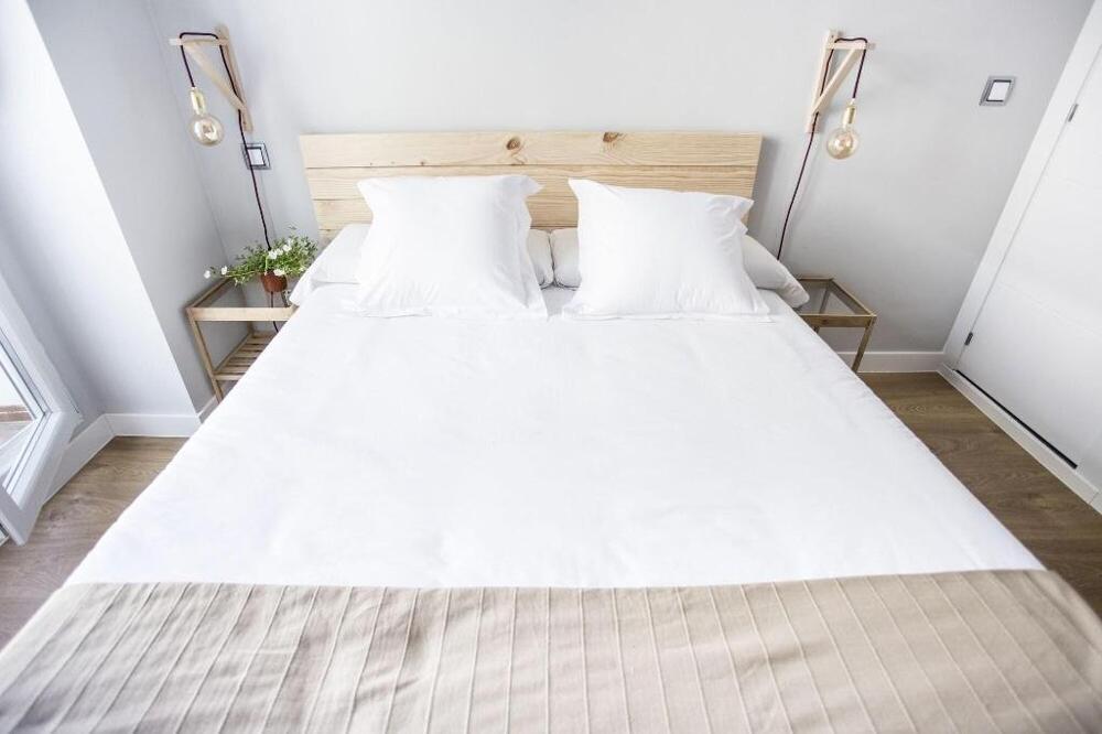 Foto de una habitación de Albergue Hola Rooms