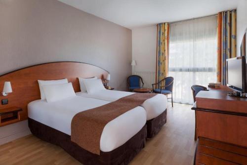 Foto de una habitación de Grand Hotel