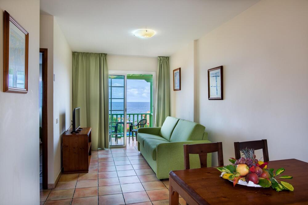 Foto de una habitación de Apartamentos La Caleta