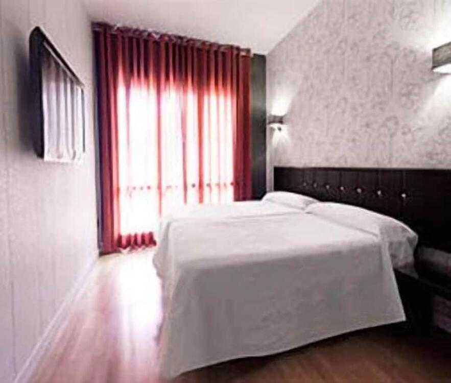Foto de una habitación de Hostal Un Punto Chic-Joaquin Costa
