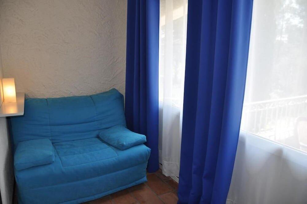 Foto de una habitación de Hotel La Cigalière
