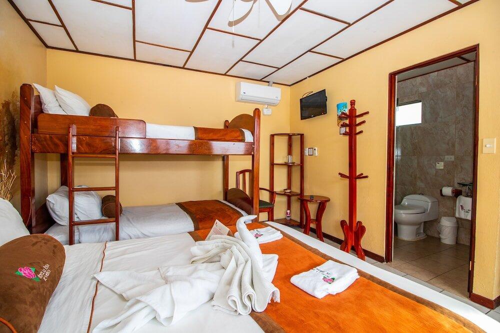 Foto de una habitación de Hotel La Rosa de America