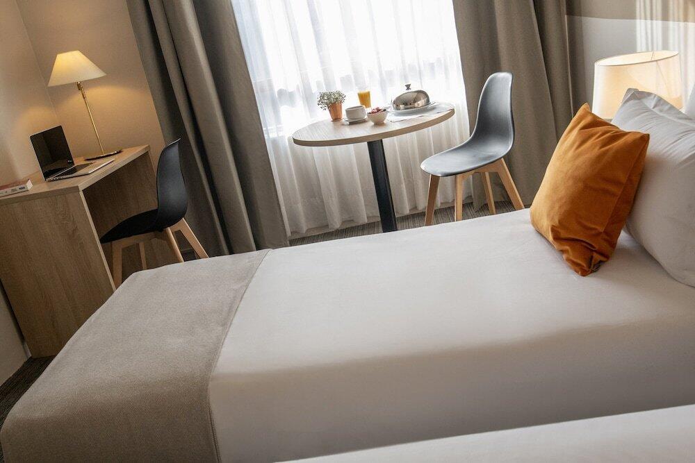 Foto de una habitación de Hotel Amarante Cannes