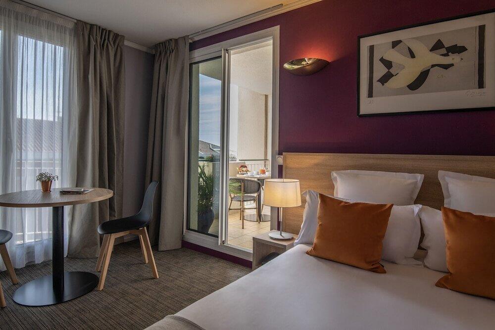 Foto de una habitación de Hotel Amarante Cannes