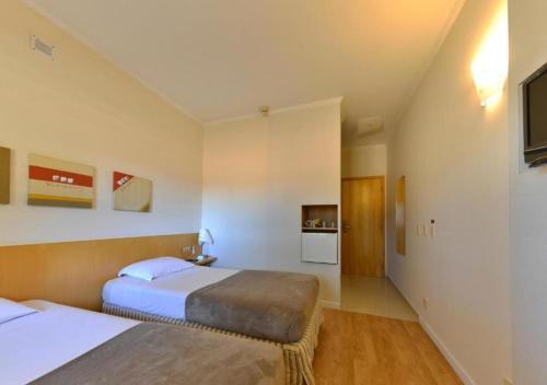 Foto de una habitación de Hotel Carlton Plaza Baobá