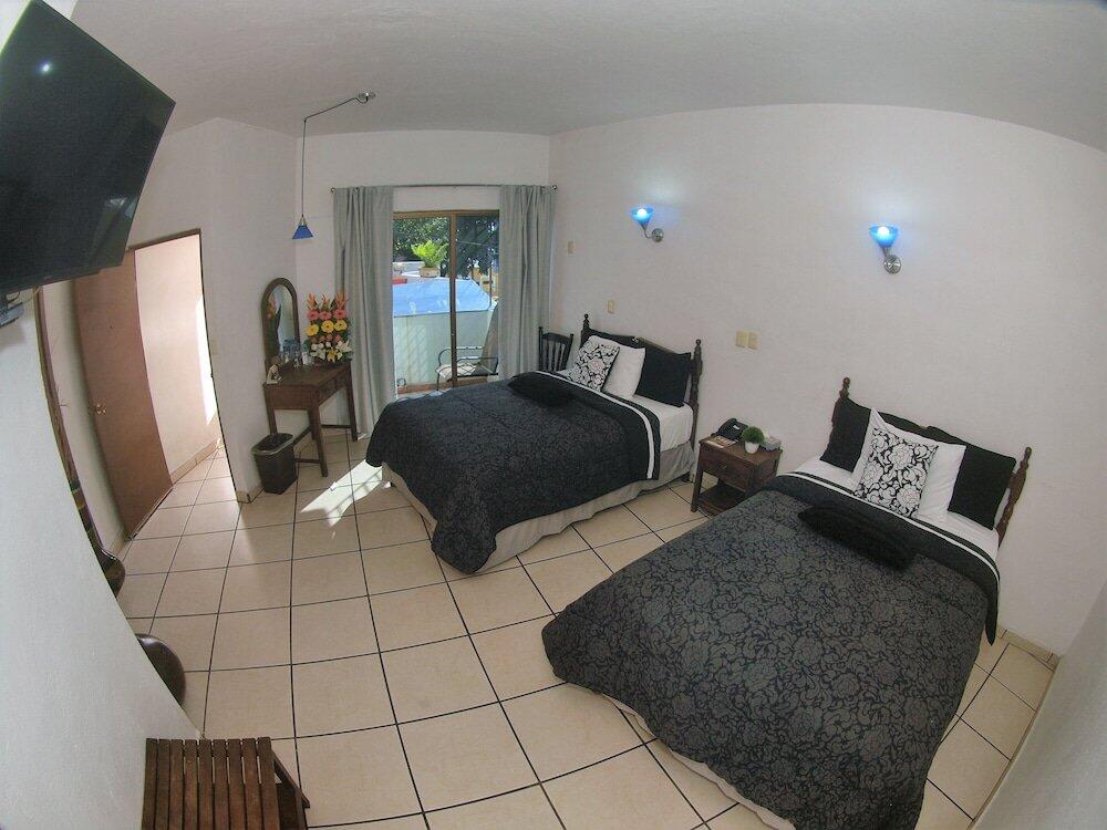 Foto de una habitación de Hotel Hospedajes Del Rey