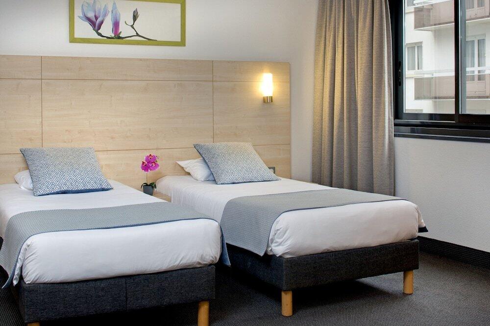 Foto de una habitación de Hôtel Padoue