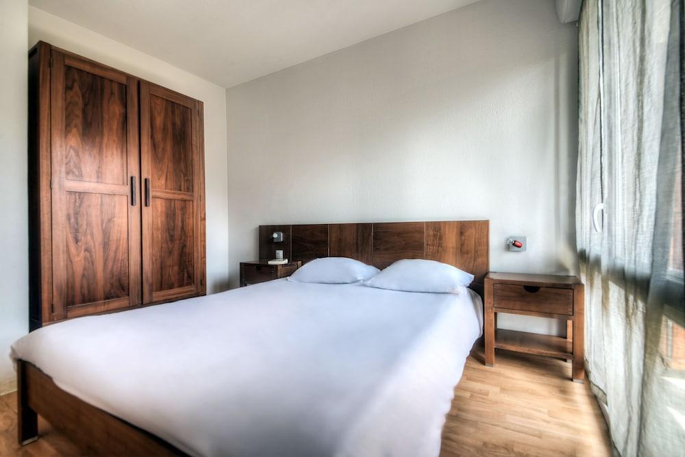 Foto de una habitación de Zenitude Hôtel-Résidences l&amp;#039;Acacia Lourdes