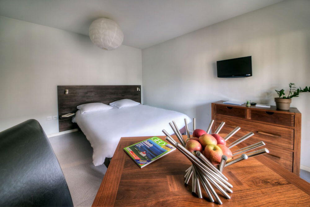 Foto de una habitación de Zenitude Hôtel-Résidences l&amp;#039;Acacia Lourdes
