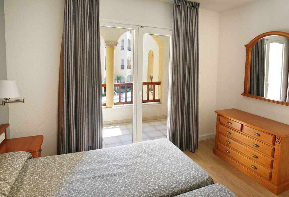 Foto de una habitación de Apartamentos turísticos Jardines del Plaza