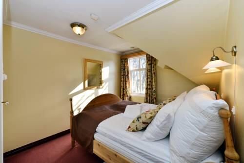 Foto de una habitación de Kronen Gaard Hotel