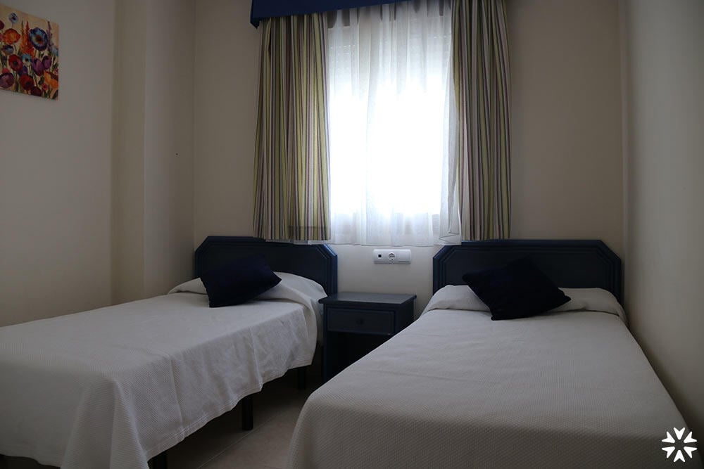 Foto de una habitación de Apartamentos Larimar Unitursa