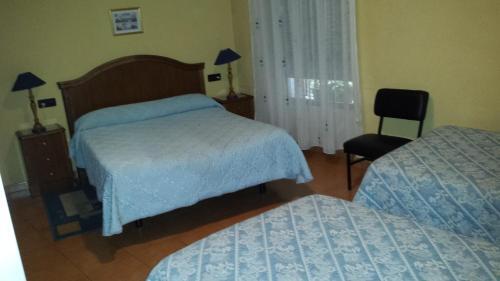 Foto de una habitación de Hostal Guzman El Bueno by gaiarooms