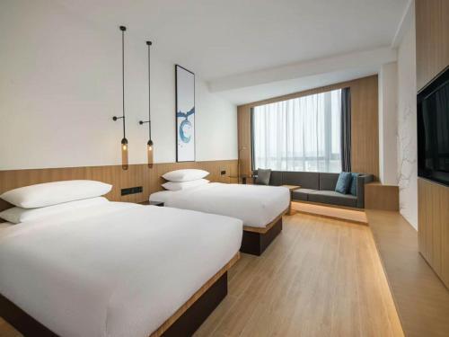 Foto de una habitación de Hotel Fairfield by Marriott Guangzhou Tianhe Park