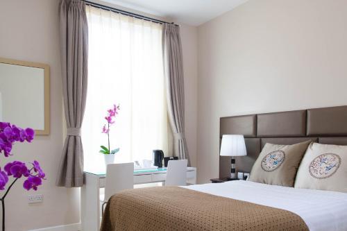 Foto de una habitación de Aparthotel Welcome Inn Victoria