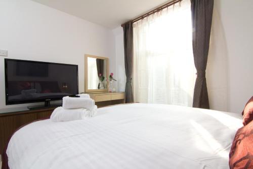 Foto de una habitación de Aparthotel Welcome Inn Victoria