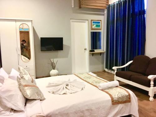 Foto de una habitación de Koimala Hotel