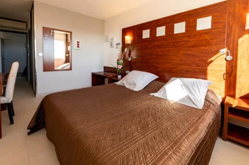 Foto de una habitación de Hotel Les Dunes