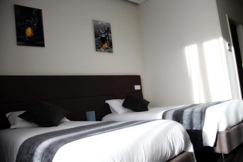 Foto de una habitación de Basto Vila Hotel