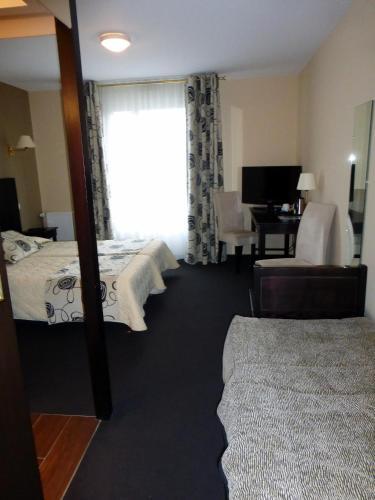 Foto de una habitación de Hôtel Ariane &amp;amp; SPA