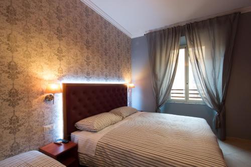 Foto de una habitación de Albergue Alessandro Palace &amp;amp; Bar
