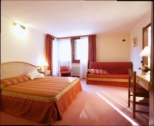 Foto de una habitación de Hotel Caminetto