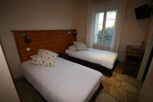 Foto de una habitación de Hotel Le Relais de la Calèche