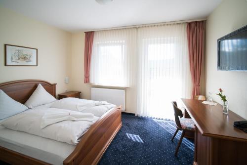 Foto de una habitación de Hotel-Burghagen