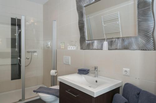 Foto del baño de Hotel Villa Altes Land