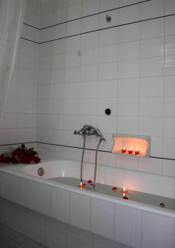 Foto del baño de Kouros Hotel