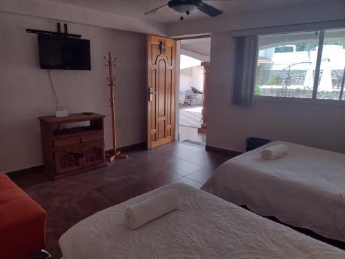 Foto de una habitación de Hotel Leyenda del Tepozteco
