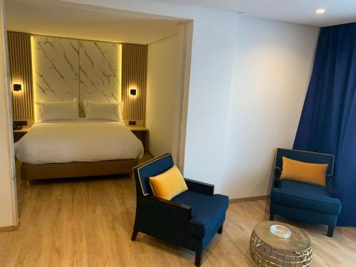 Foto de una habitación de Rihab Hotel