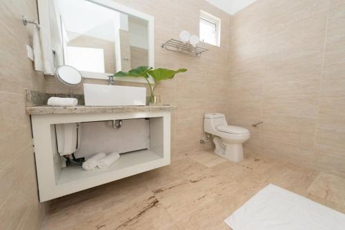 Foto del baño de Aparthotel Coson Bay
