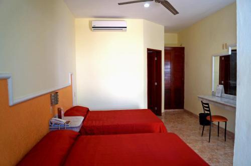 Foto de una habitación de Hotel La Palapa