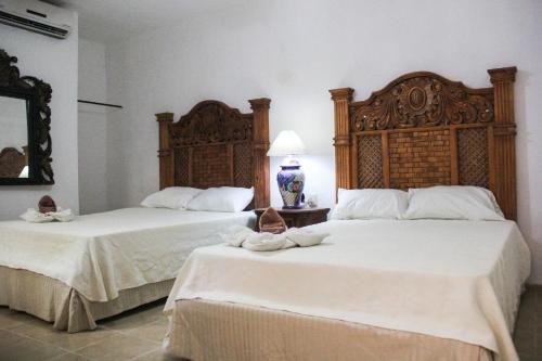 Foto de una habitación de Hotel Palacio Canton