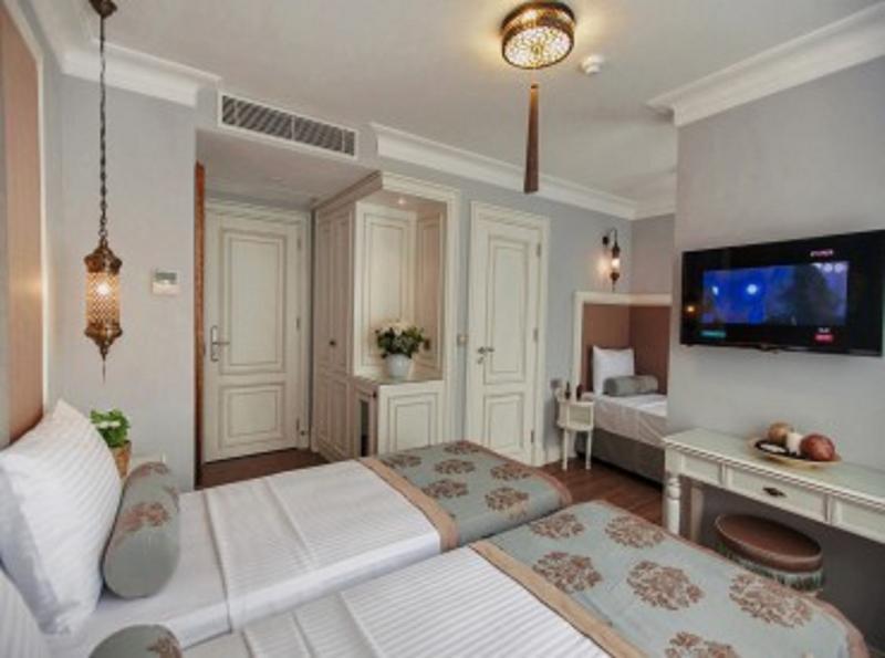 Foto de una habitación de Raymond Blue Hotel