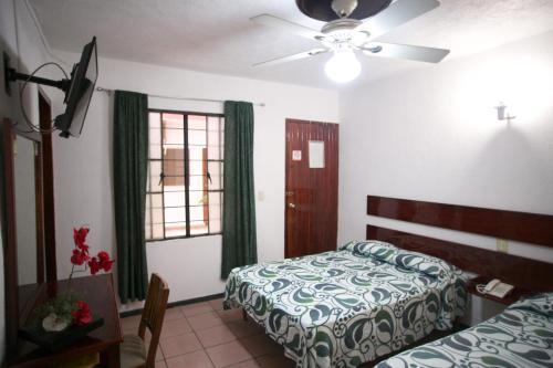 Foto de una habitación de Hotel Maria De Lourdes