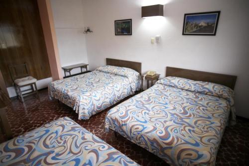 Foto de una habitación de Hotel Maria De Lourdes