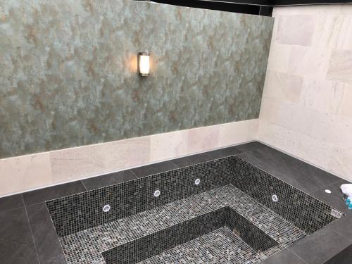 Foto del baño de Kaia Suites