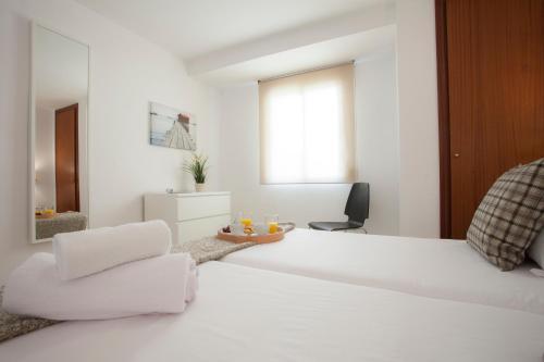 Foto de una habitación de Apartamentos SingularStays Mercado Central