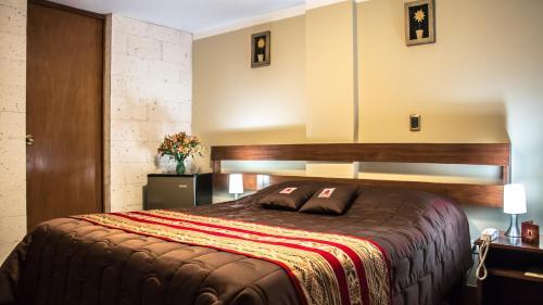 Foto de una habitación de Hotel El Portal De San Lázaro