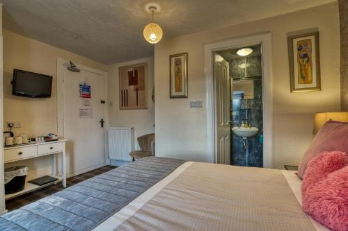 Foto de una habitación de Pitfaranne Guest House