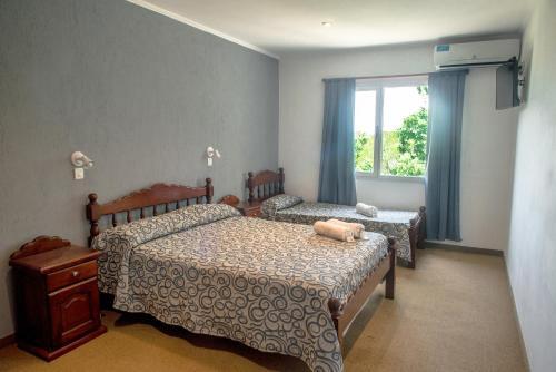Foto de una habitación de Hotel Encanto Del Mar