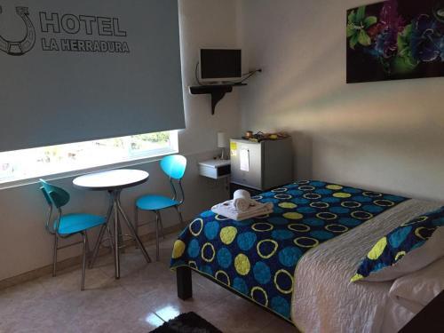 Foto de una habitación de Hotel la Herradura