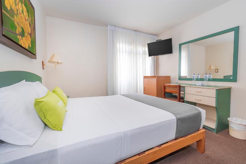 Foto de una habitación de Hotel Ayenda San Isidro Inn