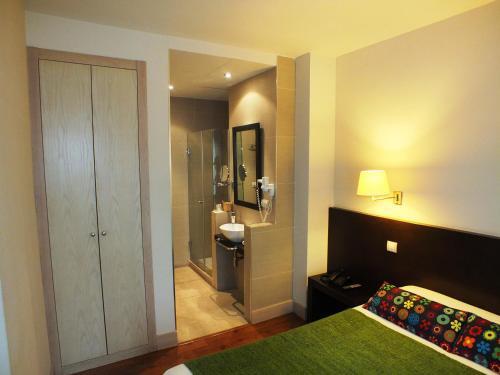 Foto de una habitación de Hotel Puerta del Arco
