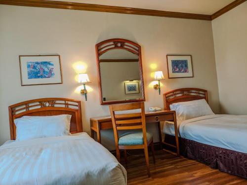 Foto de una habitación de Sabah Oriental Hotel