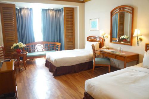 Foto de una habitación de Sabah Oriental Hotel