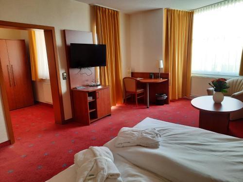 Foto de una habitación de AVALON Hotelpark Königshof